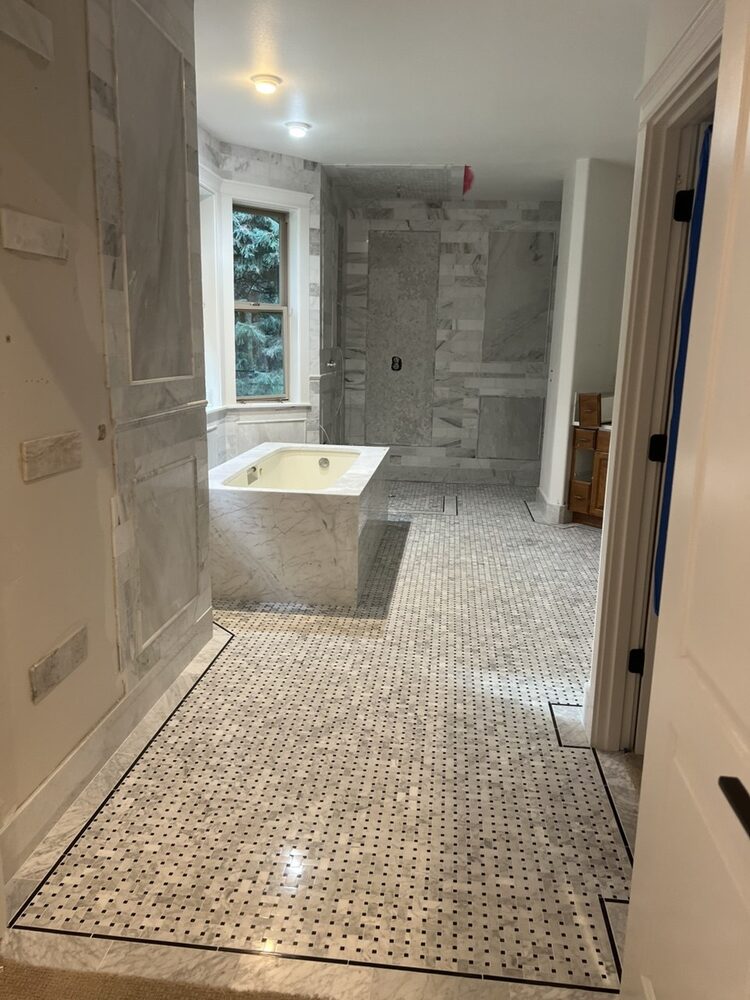 Marble bathroom remodel with soaking tub and walk-in shower — WifPros LLC project